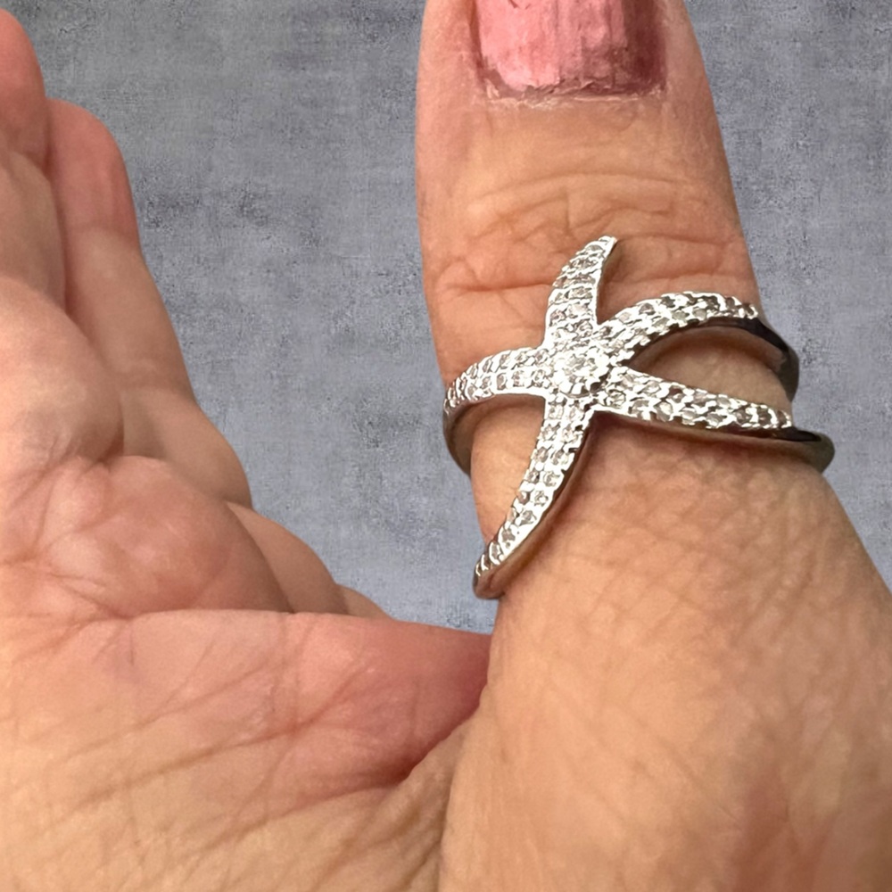 Silver sea star thumb ring, adjustable size stamped .925